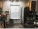 Contemporary kitchen with stainless steel appliances, sleek countertops, and ample storage at 8973 Lee Vista Blvd # 2308, Orlando, FL 32829