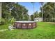 This backyard features an above-ground pool and a shed at 10140 Bridlewood Ave, Orlando, FL 32825