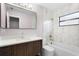 Modern bathroom with new vanity, marble tile, and combined tub and shower at 10140 Bridlewood Ave, Orlando, FL 32825