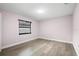 Compact bedroom with wood-look floors and a single window at 10140 Bridlewood Ave, Orlando, FL 32825