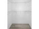 This is a walk-in closet with wire shelving and wood-look flooring at 10140 Bridlewood Ave, Orlando, FL 32825