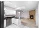 Modern kitchen with white cabinets, stainless steel appliances, and open layout at 10140 Bridlewood Ave, Orlando, FL 32825