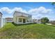 Expansive back yard with a covered patio and ample space for outdoor activities at 1018 Boxelder Ave, Minneola, FL 34715
