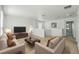 Upstairs living room with furniture and mounted TV, perfect for relaxation and gatherings at 1018 Boxelder Ave, Minneola, FL 34715