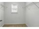 Walk-in closet with a window and wire shelving offers efficient storage at 1018 Boxelder Ave, Minneola, FL 34715