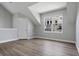 Bright attic space with a large window and wood-look floors at 1106 Celebration Ave, Celebration, FL 34747