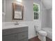 Bathroom featuring a window, bathtub with shower, and sink vanity at 1106 Celebration Ave, Celebration, FL 34747