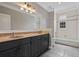 Bathroom featuring a double vanity and bathtub with shower at 1106 Celebration Ave, Celebration, FL 34747