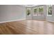 Large bedroom features several windows for ample light, beautiful floors, and decorative trim with modern neutral paint at 1106 Celebration Ave, Celebration, FL 34747