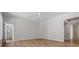Bright bedroom boasts hardwood floors, neutral walls, a ceiling fan, and an ensuite bathroom for added convenience at 1106 Celebration Ave, Celebration, FL 34747