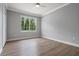 Inviting bedroom with a ceiling fan and a large window overlooking trees at 1106 Celebration Ave, Celebration, FL 34747
