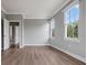 An empty bedroom showcasing light-colored walls and wood-look flooring at 1106 Celebration Ave, Celebration, FL 34747
