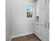 Hallway closet has white cabinets and drawers, hardwood floors and a window that provides natural lighting at 1106 Celebration Ave, Celebration, FL 34747