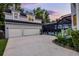 A long driveway with garage and a fenced pool is adjacent to the home at 1106 Celebration Ave, Celebration, FL 34747