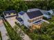 A two story home with an attached garage and mature trees surrounding the property at 1106 Celebration Ave, Celebration, FL 34747