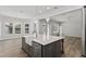 Spacious kitchen island with a farmhouse sink, stylish pendants, and open layout, perfect for entertaining at 1106 Celebration Ave, Celebration, FL 34747