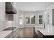 Bright kitchen featuring stainless steel appliances, a farmhouse sink, designer fixtures, and bay windows at 1106 Celebration Ave, Celebration, FL 34747