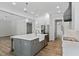 Modern kitchen with a large island, stainless steel appliances, and pendant lighting, creating an inviting space at 1106 Celebration Ave, Celebration, FL 34747