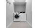 Convenient laundry room with a washer, dryer, and shelving at 1106 Celebration Ave, Celebration, FL 34747