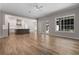 Open-concept living area with a kitchen view, featuring hardwood floors, ample natural light, and modern fixtures at 1106 Celebration Ave, Celebration, FL 34747