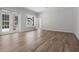 Bright living room featuring natural light, hardwood floors, and access to an outdoor space, offering a serene setting at 1106 Celebration Ave, Celebration, FL 34747