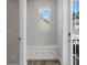 Mud room features built-in bench with drawers for storage, a window, and access to the exterior through glass doors at 1106 Celebration Ave, Celebration, FL 34747