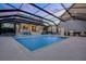 Private screened-in pool area with an outdoor kitchen, lots of space for entertaining, and a covered patio at 1106 Celebration Ave, Celebration, FL 34747