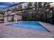 Stunning, enclosed in-ground pool with a beautiful patio and comfortable lounge seating at 1106 Celebration Ave, Celebration, FL 34747