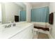 Bathroom with a sink, white countertop, and a shower/tub combo, offering convenience and functionality at 12272 Bracco St, Winter Garden, FL 34787