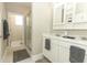 Bathroom with double sinks, white cabinets, and a glass-enclosed shower for a spa-like experience at 12272 Bracco St, Winter Garden, FL 34787