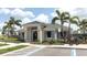 Attractive clubhouse featuring landscaping, palm trees, and designated accessible parking at 12272 Bracco St, Winter Garden, FL 34787