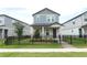 Charming two-story home boasts a well-maintained lawn and sleek black fence, creating a welcoming curb appeal at 12272 Bracco St, Winter Garden, FL 34787