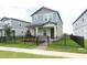Inviting two-story home featuring a landscaped yard and a modern black fence, exuding suburban charm at 12272 Bracco St, Winter Garden, FL 34787