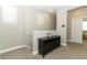 Cozy loft space with neutral walls, carpet flooring, a storage cabinet, and natural lighting at 12272 Bracco St, Winter Garden, FL 34787