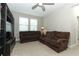 Carpeted loft area featuring comfortable seating, ample natural light, and a built-in entertainment center at 12272 Bracco St, Winter Garden, FL 34787