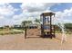 Community playground featuring a play structure and safe play area with mature landscaping at 12272 Bracco St, Winter Garden, FL 34787