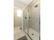 Modern bathroom shower featuring glass door, a tiled shower with shower head, and neutral decor at 12272 Bracco St, Winter Garden, FL 34787