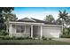 Charming single-story home featuring a stone-accented facade, covered porch, and attached two-car garage at 12954 Promise Pl, Orlando, FL 32832