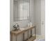Entryway displaying an elegant console table with stylish decor, mirror, and inviting ambiance at 12954 Promise Pl, Orlando, FL 32832