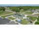 Expansive aerial view of a well-maintained property with lush green lawn, fenced yard, and modern solar panels at 1325 Mcneil Rd, Altamonte Springs, FL 32714