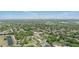Scenic aerial view of a lush residential neighborhood with mature trees and a glimpse of a distant city skyline at 1325 Mcneil Rd, Altamonte Springs, FL 32714