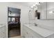 Bathroom with vanity, marble countertop, and an open doorway that shows the main bedroom at 1325 Mcneil Rd, Altamonte Springs, FL 32714