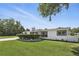 Beautiful home with vibrant green lawn, fresh driveway and healthy, trimmed front shrubbery at 1325 Mcneil Rd, Altamonte Springs, FL 32714