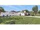 Charming white home with a large front lawn, privacy fence, and well-maintained landscaping at 1325 Mcneil Rd, Altamonte Springs, FL 32714