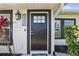 Charming front entrance featuring a dark door, updated house numbers, and well-maintained landscaping at 1325 Mcneil Rd, Altamonte Springs, FL 32714