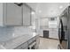 Modern kitchen with white and grey cabinets and stainless steel appliances at 1325 Mcneil Rd, Altamonte Springs, FL 32714