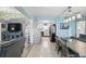 An open living space featuring updated tile flooring, a partial view of the kitchen, and neutral color accents at 1325 Mcneil Rd, Altamonte Springs, FL 32714