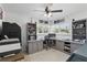 Office featuring built-in desk and shelving, large window, and neutral color scheme at 1325 Mcneil Rd, Altamonte Springs, FL 32714