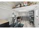 Finished shed interior with desk and seating, shelving, and accent rug at 1325 Mcneil Rd, Altamonte Springs, FL 32714