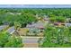 Aerial view displays the property's screened pool, landscaping, and neighborhood at 1440 Suzanne Way, Longwood, FL 32779